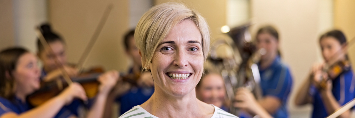 Teacher in front of music students