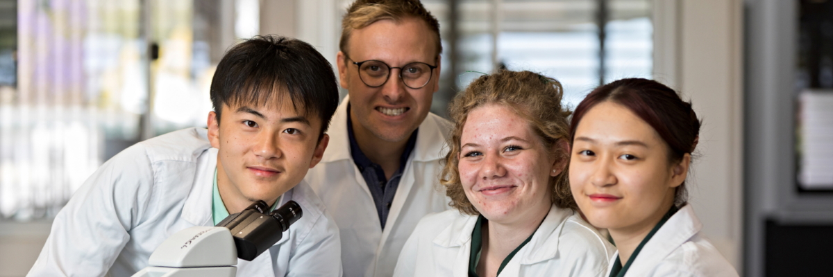 Science students wearing lab coats