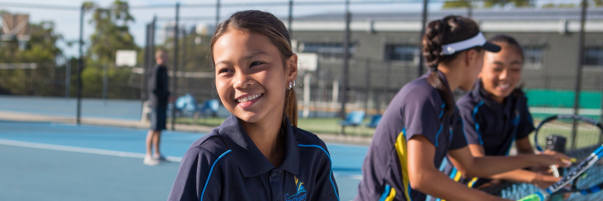 Students on a tennis court