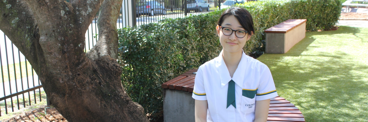 A student sitting on a bench