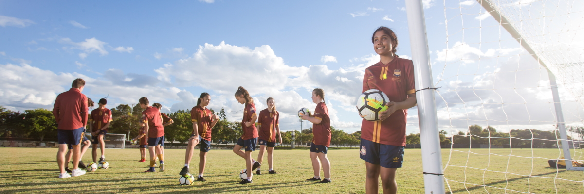 Students outside with soccer balls