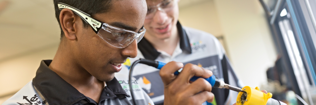 Students using a soldering iron