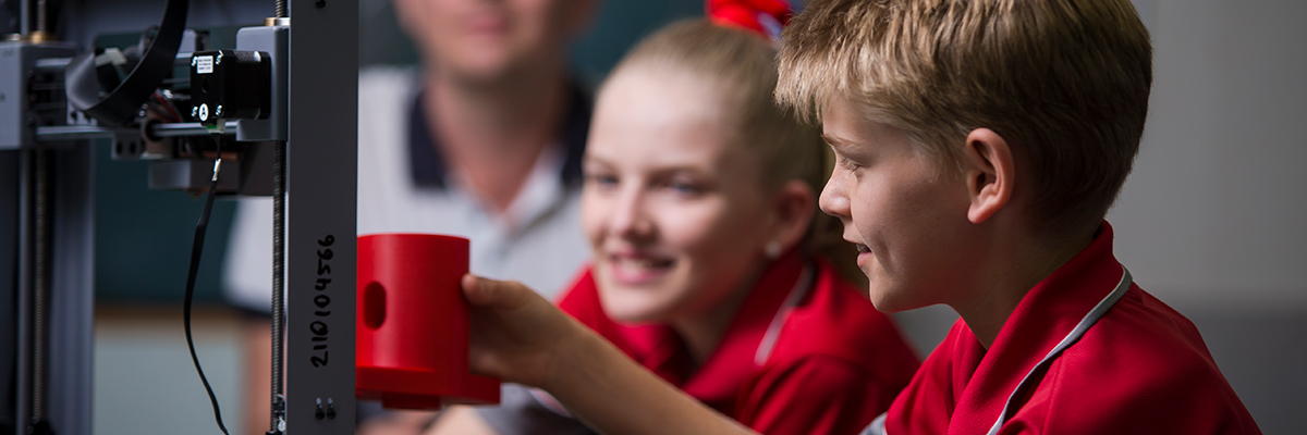 Students and a 3D printer